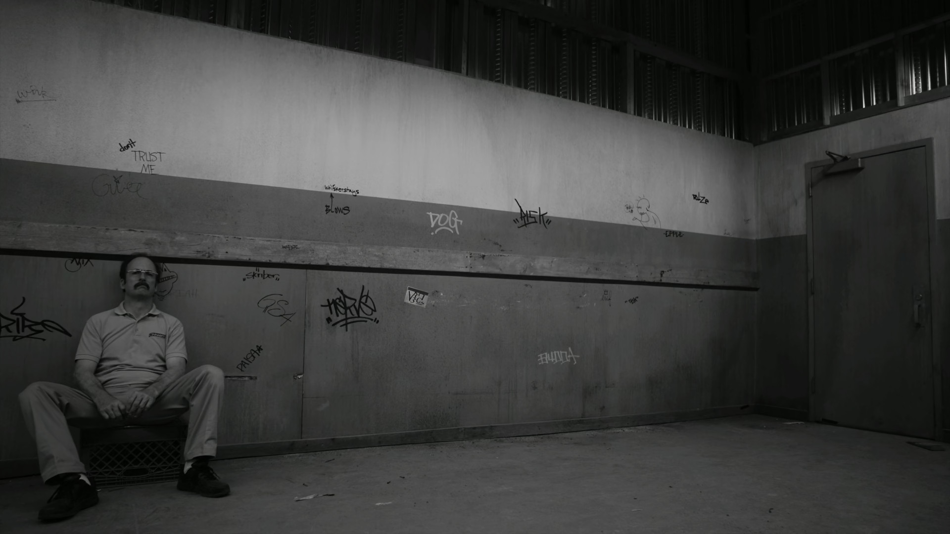 Saul waits for a janitor to open the door